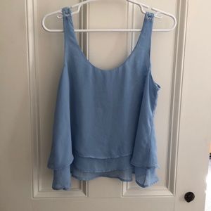 Blue flowy tank top with lace back